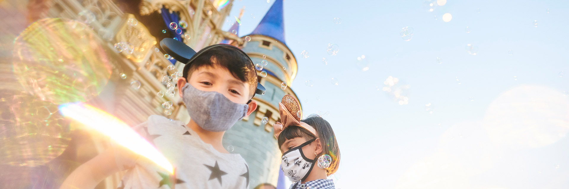 Boy and girl in front of It's a Small World