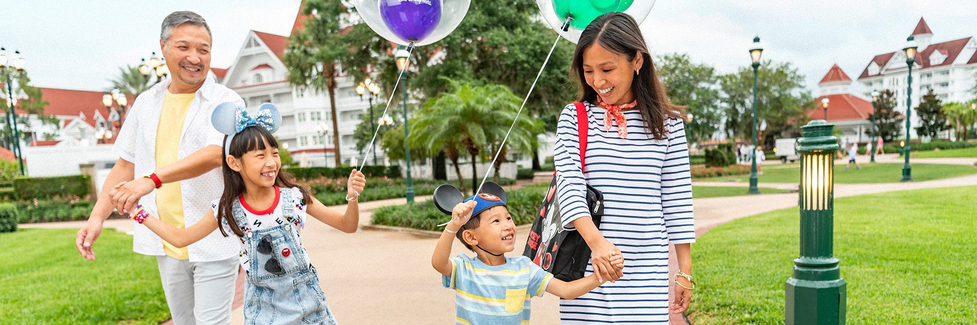 Family with Mickey balloons at Grand Floridian; Asian; mother; father siblings
