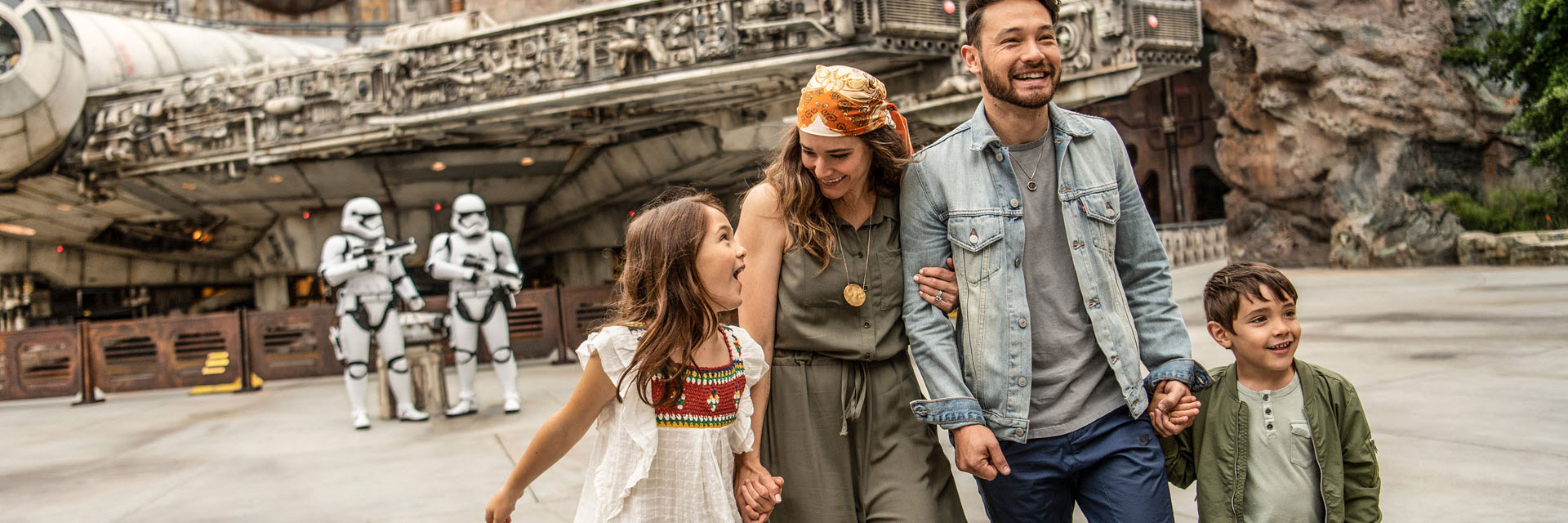 Star Wars Galaxy's Edge Millennium Falcon: Smugglers Run; Family Walking away from Storm Troopers holding hands