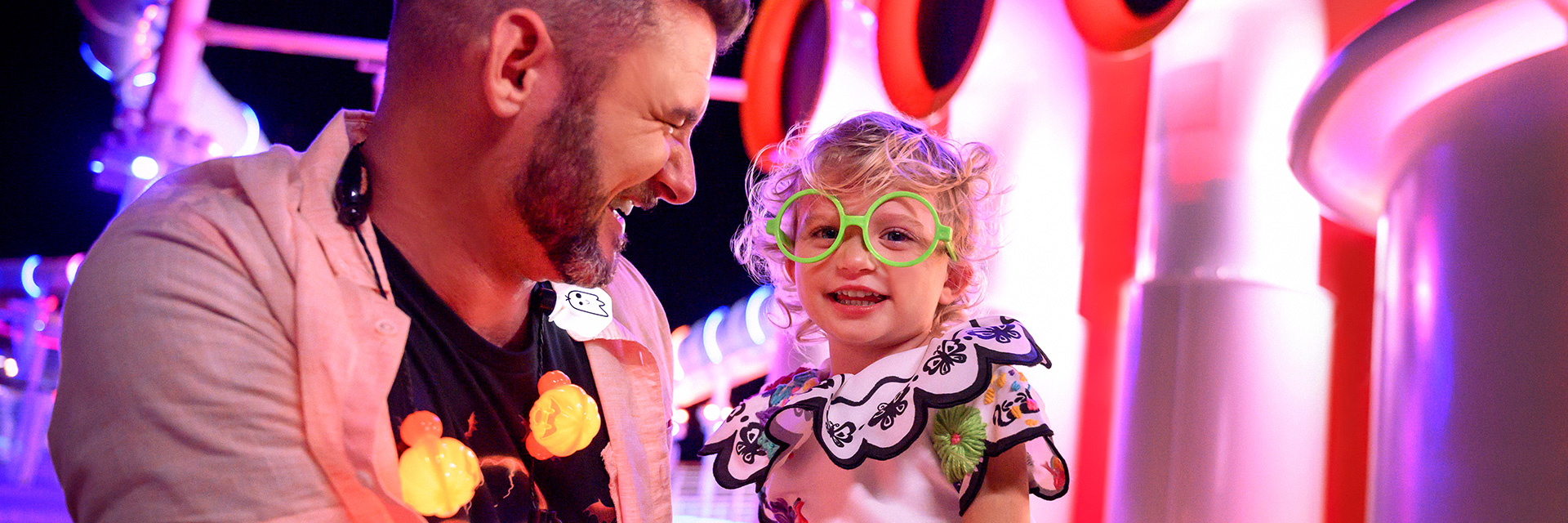 Little Girl in costume as Encanto and Dad on Deck_Halloween on the High Seas; dad looks at child in costume