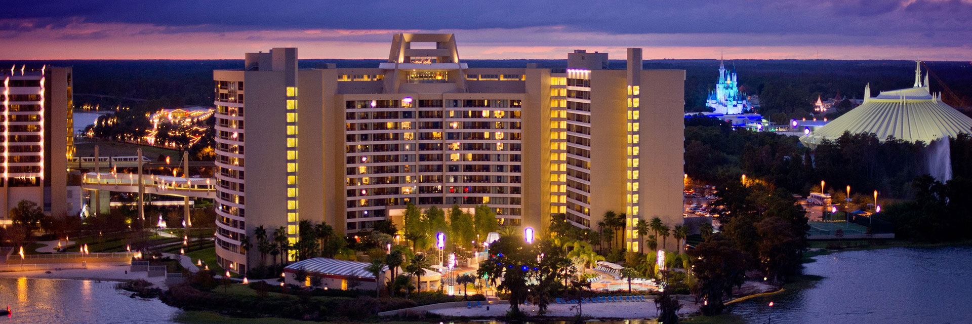 Bay-Lake Tower in the evening after sunset; space mountain; cinderella castle ; back view