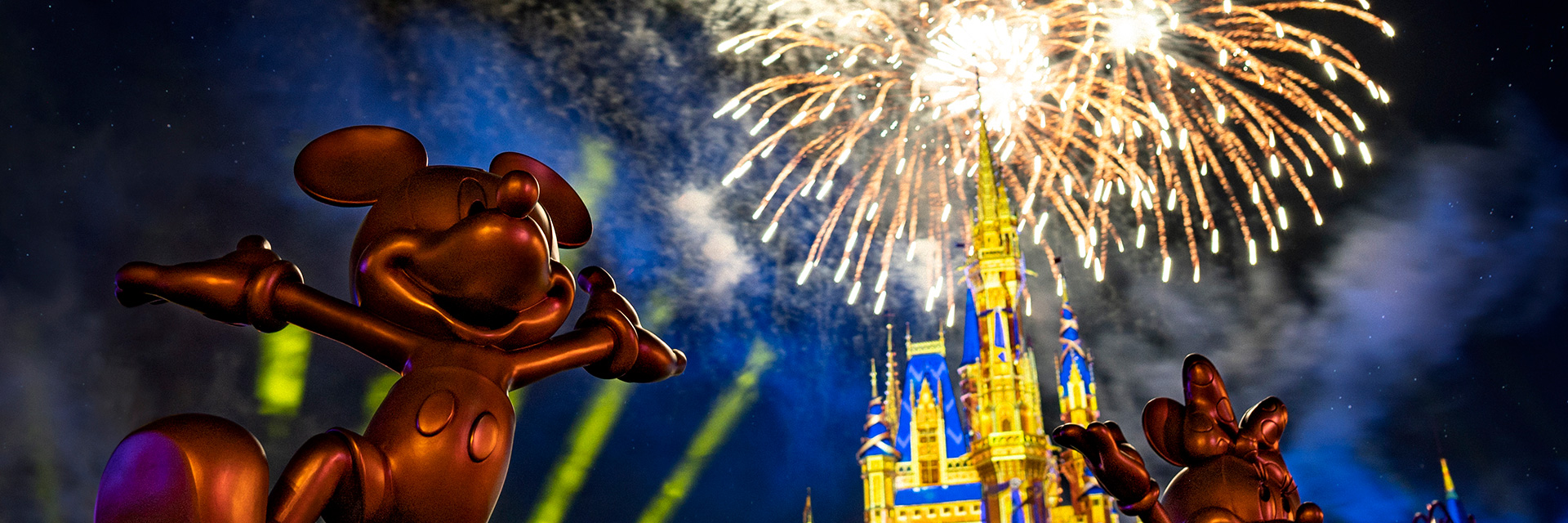 Mickey and Minnie Statues in Front of Fireworks
