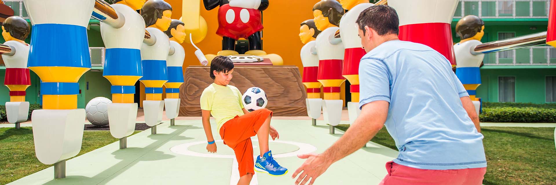 All Star Sports Resort; mickey; table hockey statues; father and son