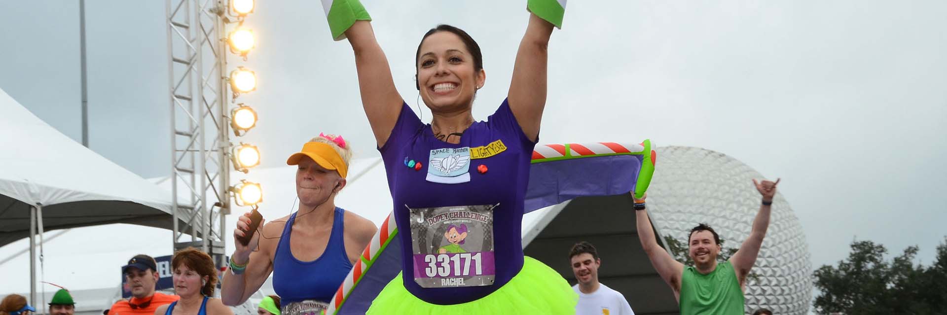 woman with arms up running