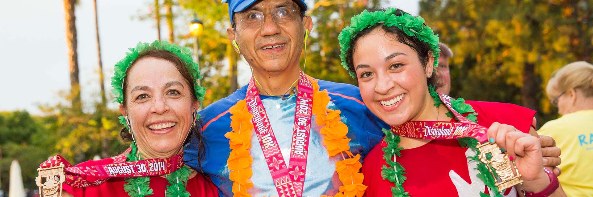Family with medals; 10K race; RunDisney; Lilo and Stitch