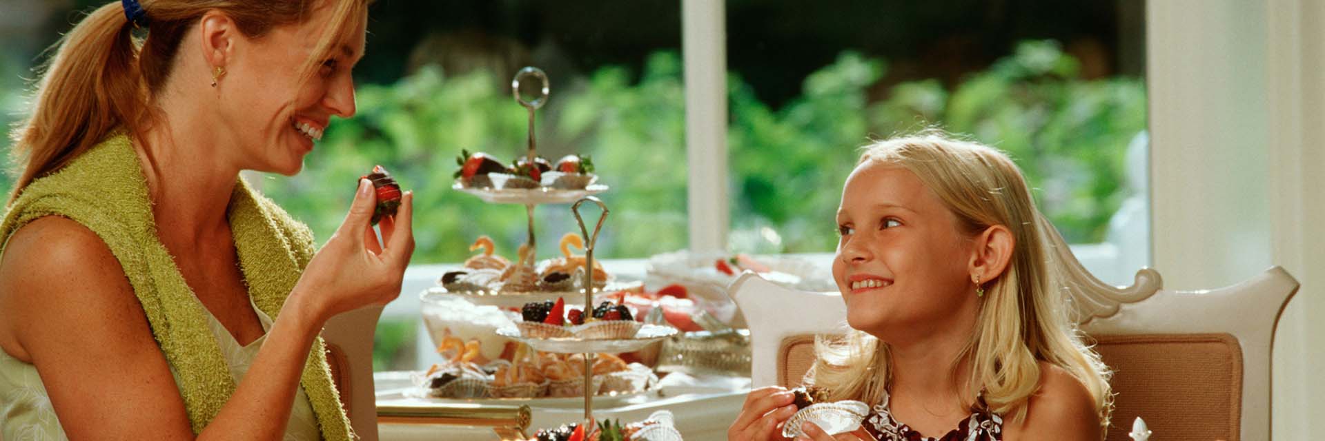 mom and daughter eating at Disney Princess Tea Party