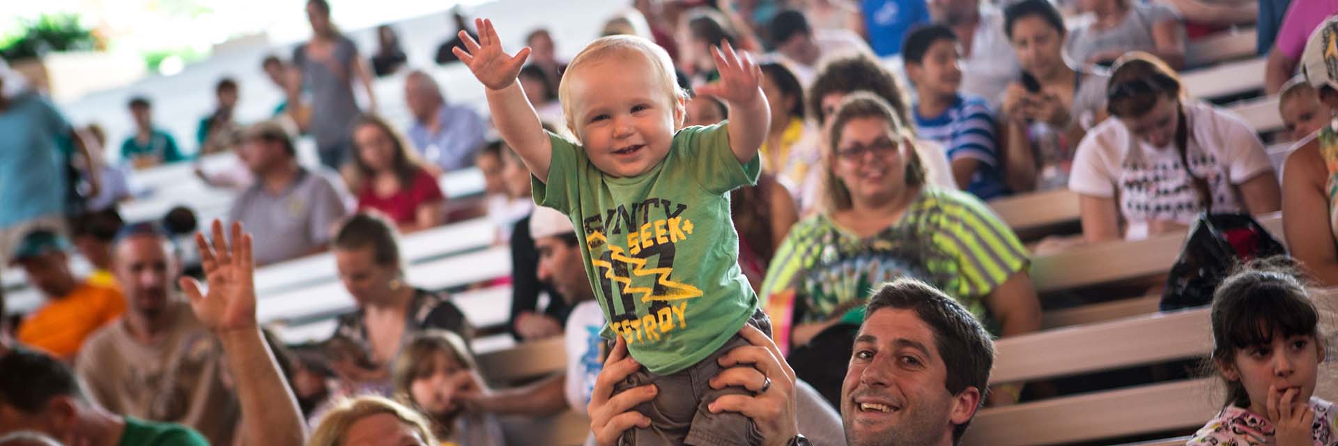 infant at live stage show; father and son; infant boy