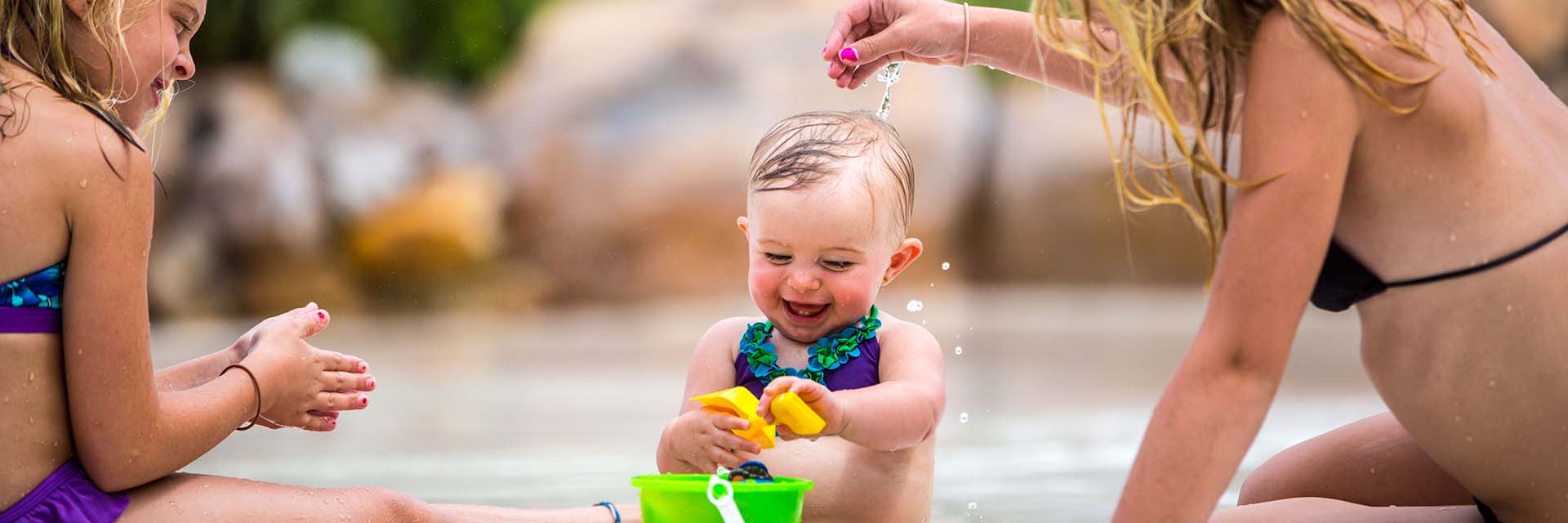 Baby Girl With Family at Pool