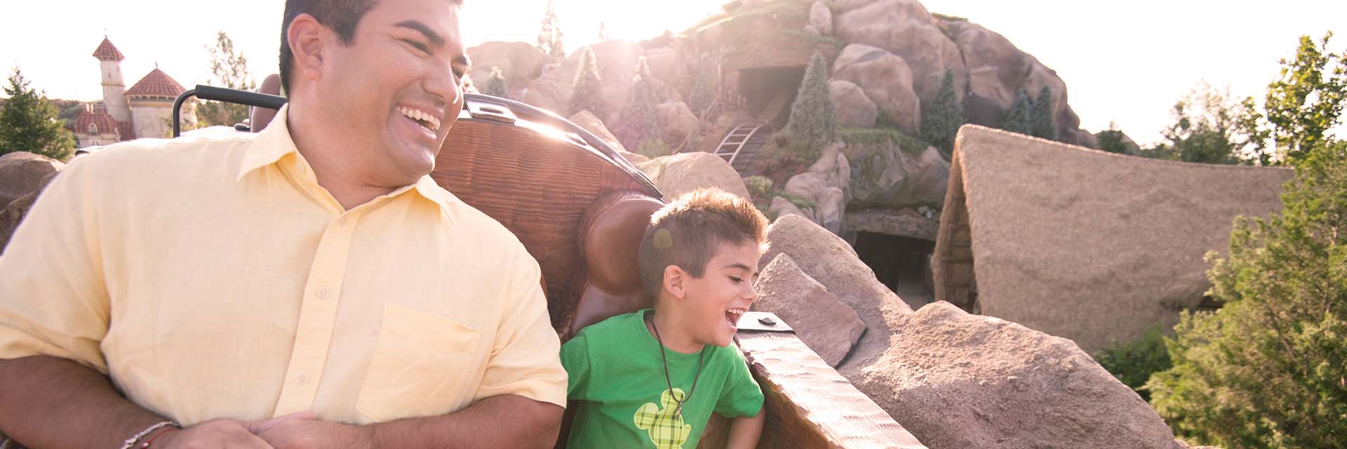 Father and Son riding Seven Dwarfs Mine Train; Magic Kingdom
