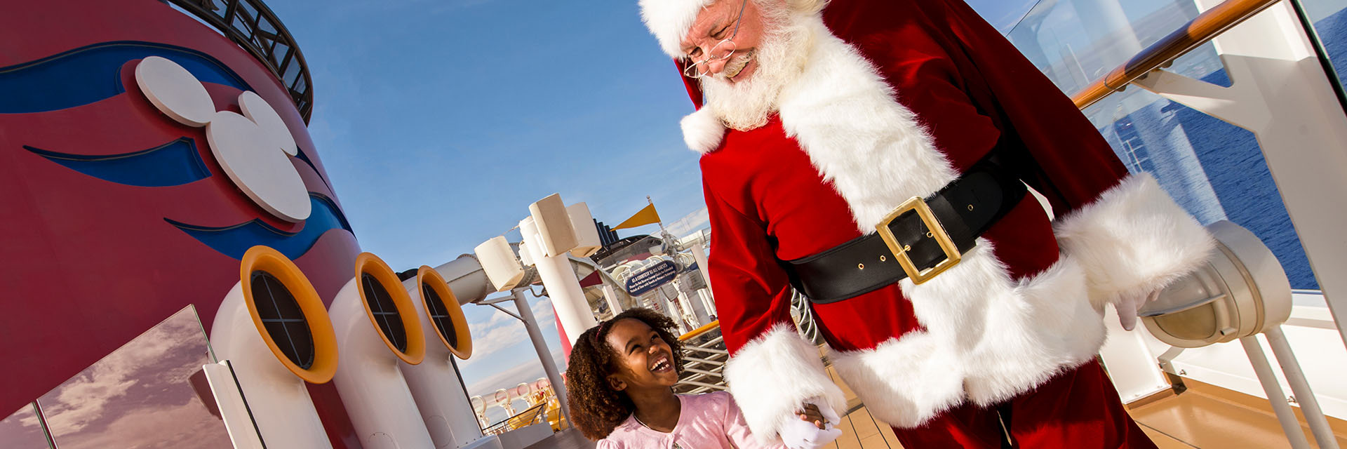 Santa and AA child, walking and holding hands together on ship